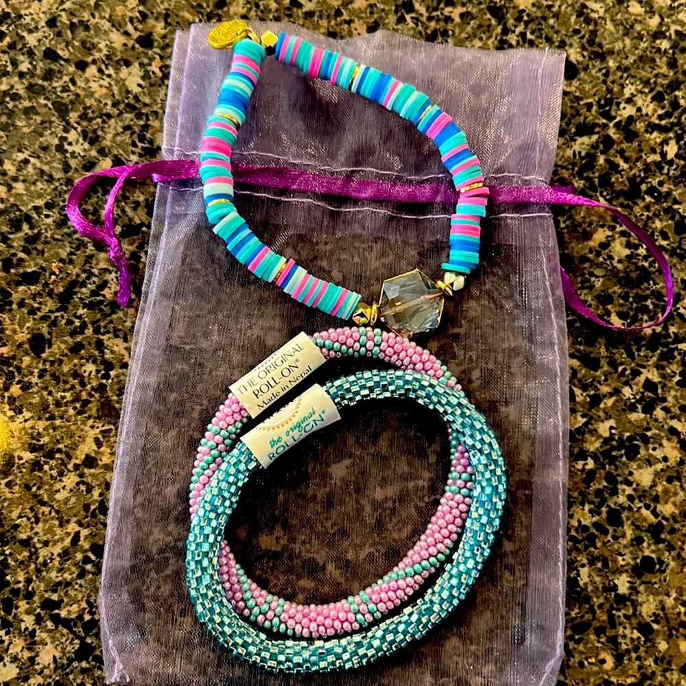 Two Original Roll on bracelets and 1 other bracelet. Perfect for tweens